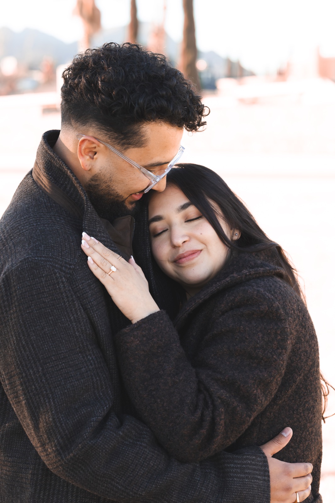 A couple embracing in the evening light