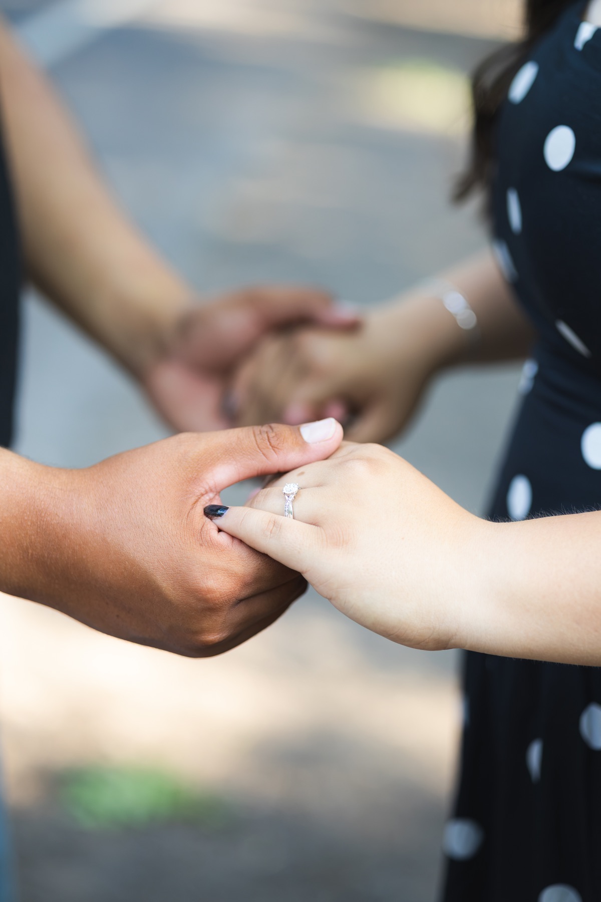 A close view of a couple holding hands